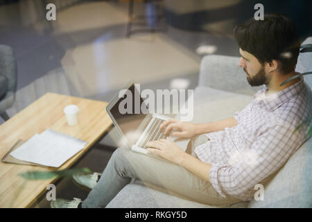 Modern man working remotely Stock Photo