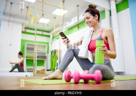 Young Woman Relaxing after Workout Stock Photo