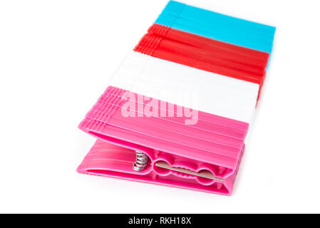 Colorful clothes  pegs made of plastic in  a row Stock Photo