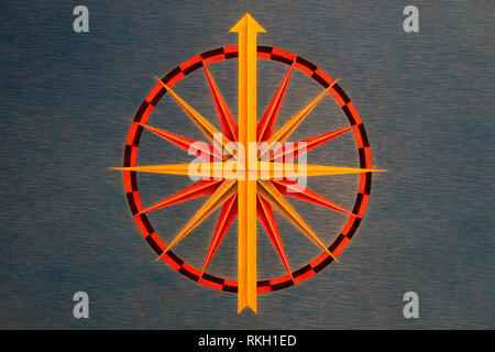 Cardinal Points yellow red and black on grey tapestry background Stock Photo