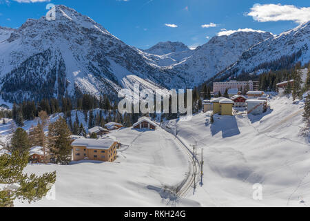 beautiful winter landscape with rhaetian railway around village arosa in switzerland Stock Photo