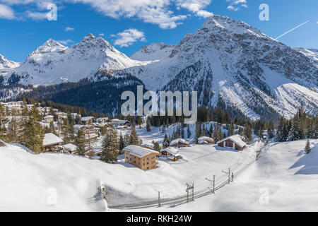 beautiful winter landscape with rhaetian railway around village arosa in switzerland Stock Photo