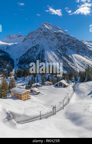 beautiful winter landscape with rhaetian railway around village arosa in switzerland Stock Photo