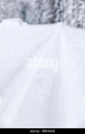 Closeup of long ski tracks in deep white snow at winter Stock Photo - Alamy