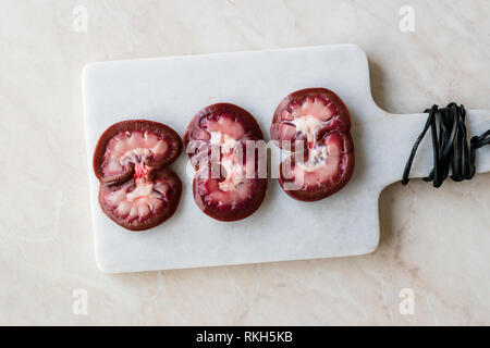 Sliced Raw Lamb Kidney on Marble Board. Organic Product. Stock Photo