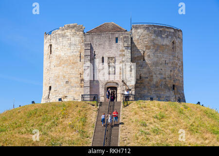 Clifford's Tower the former Keep of York castle tourists climbing the steep steps to Cliffords tower city of York North Yorkshire England UK GB Europe Stock Photo