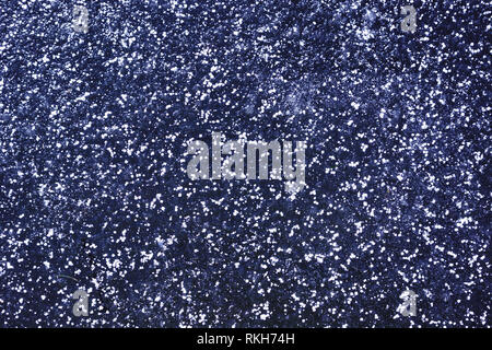 Dark blue ice background with small snippets of white hoarfrost Stock Photo