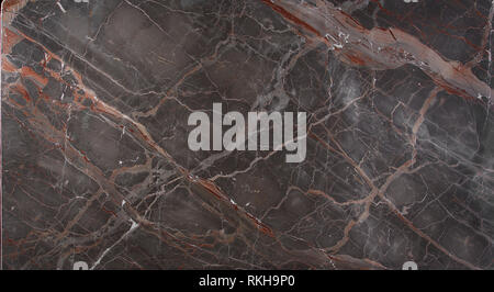 Marble slab brown with pink and red stripes is called Caravaggio, natural stone, marble texture. Stock Photo