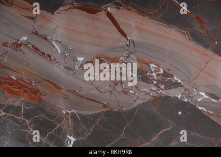 Marble Slab brown with pink and red veins, called Caravaggio, natural stone, marble texture. Stock Photo