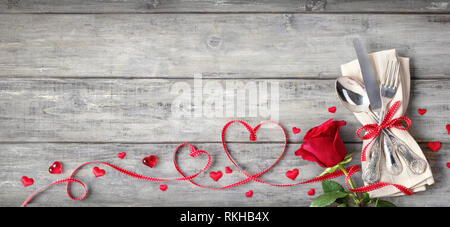 Romantic Setting Table - Vintage Silverware With Napkin Ribbon On Wooden Plank Stock Photo