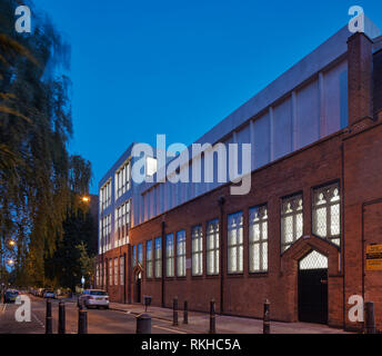 Street view showing additional floor at dusk. Gatehouse School, LONDON, United Kingdom. Architect: Child Graddon Lewis , 2018. Stock Photo