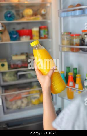 Orange juice bottles in refrigerator Stock Photo - Alamy