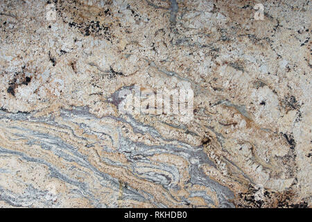 Light granite with patterns on the surface, called Golden cascade, stone texture, marble background Stock Photo