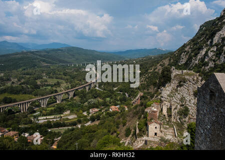 The panorama from San Severino di Centola, a ghost village in Campania, Italy. A spectacular viaduct of highway is visible among the hills Stock Photo