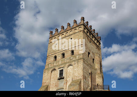 Old masonry of fortification tower at ancient castle over cloudy sky Stock Photo