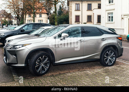 Paris, France - Jan 1, 2018: Side view of LEXUS RX 450h luxury silve SUV hybrid car parked on French street Stock Photo