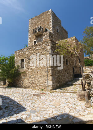 Old stone tower housed in traditional medieval village in Mani, Greece. Stock Photo