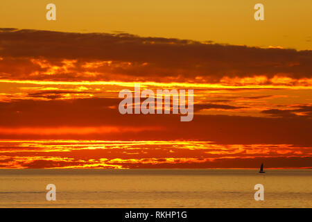 San Clemente Fire Sky with Sailboat at Sunset, San Clemente, CA Stock Photo
