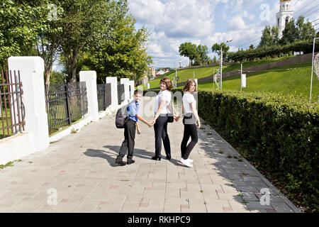 Happiest mother with daughter and son are walking at summer Stock Photo