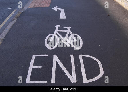 cycle lane markings on portsmouth road, kingston, surrey, england, denoting the end of a cycle lane and that cyclists should turn left Stock Photo