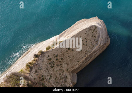 Sandstone formations or cliffs along coastline Stock Photo