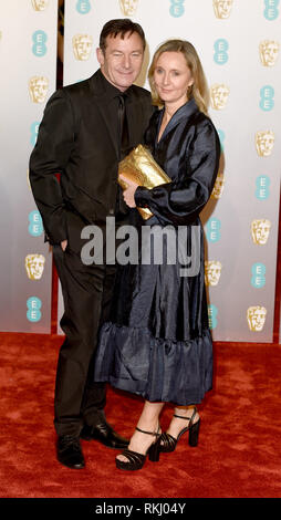 Photo Must Be Credited ©Alpha Press 079965 10/02/2019  Emma Hewitt and Jason Isaacs  EEÊBaftaÊBritish AcademyÊFilmÊAwardsÊ2019Êat The Royal Albert Hall London Stock Photo