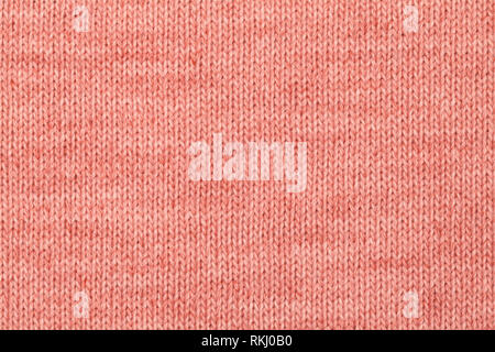 Living coral trendy color of the year 2019 knitted fabric made of heathered yarn textured background Stock Photo