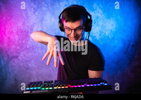 Portrait of funny nerd working on computer Stock Photo
