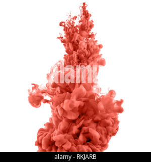 coral splashes of ink in water isolated on white Stock Photo