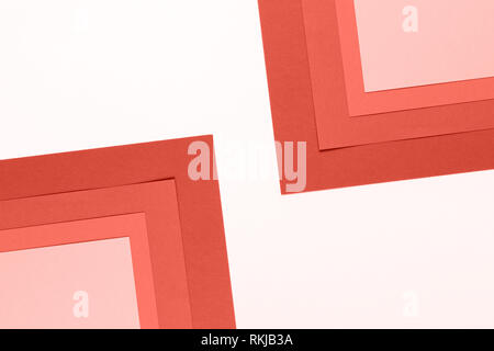 colored coral paper texture minimalism background. pink paper sheets. Stock Photo