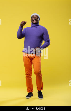 Positive delighted young man looking straight at camera Stock Photo