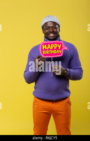 Positive delighted young man looking straight at camera Stock Photo