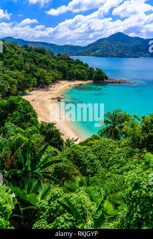 Tropical Laem Sing beach. Beautiful turquoise bay and people relaxing on beach. Paradise coast of Phuket, Thailand. Stock Photo