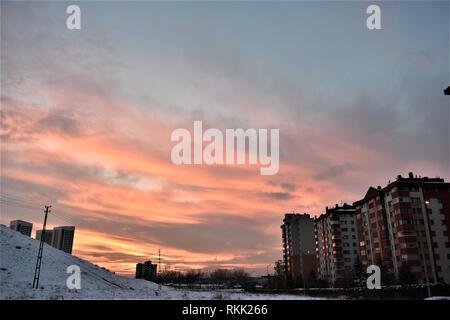 Ankara, Turkey. 10th Jan, 2019. Clouds cover a blood red sky over residential buildings during sunset in a western suburb. Credit: Altan Gocher | usage worldwide/dpa/Alamy Live News Stock Photo