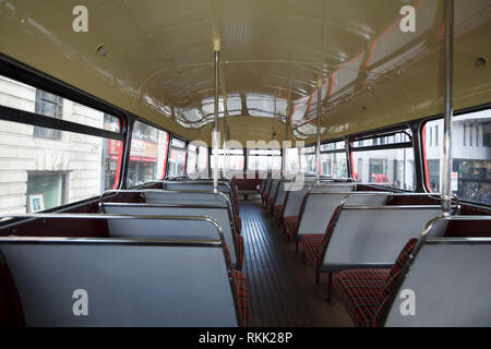 London, UK. 11th February 2019. Interior upper deck of the heritage Routemaster red bus with conductor, still operating daily  until the 1st of March this year, when the bus will run only on weekends. Credit: Joe Kuis / Alamy Live News Stock Photo
