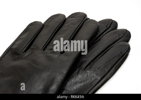 Pair of men's black leather gloves isolated on a white background in close-up Stock Photo