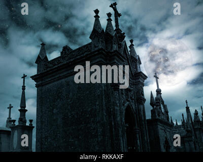 Halloween night scenery with full moon, cloudy sky, stars and old European cemetery Stock Photo