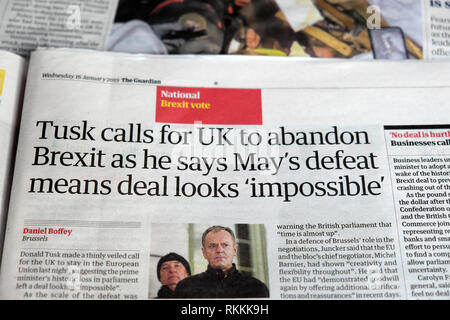 'Tusk calls for UK to abandon Brexit as he says May's defeat means deal looks 'impossible'  ' Guardian newspaper article 26 January 2019  London UK Stock Photo