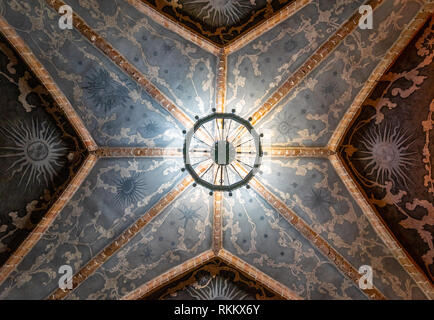 Ancient chandelier's silhouette on brick painted background - Ceiling - in Trakai Island Castle Chapel