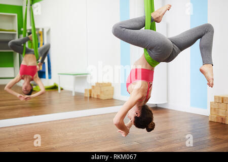 Woman Enjoying Aeral Yoga Stock Photo