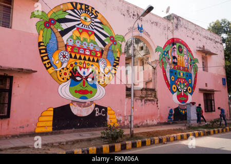 Group of young men filming in front of large street mural by Indian artist Harsh Raman, in Lodhi Colony, New Delhi, India Stock Photo