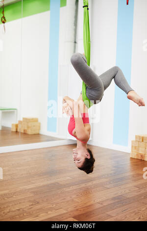 Woman doing Aeral Yoga Stock Photo