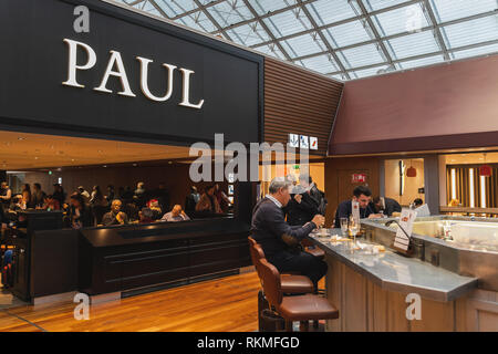 CDG Airport, Paris - 12/22/18: Paul logo above food court area in Paris airport. Logo of famous French bakery and restaurant. Stock Photo