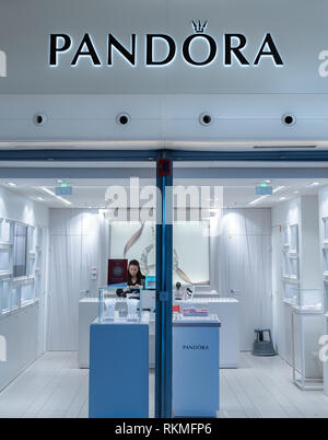 CDG Airport, Paris - 12/22/18: Beautiful Pandora jewelry fashion luxury brand shop logo in Paris France well illuminated with bright white light Stock Photo