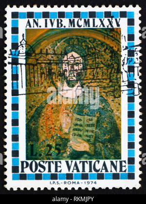 VATICAN - CIRCA 1974: a stamp printed in the Vatican shows Christ, St. Peter’s Basilica, circa 1974 Stock Photo