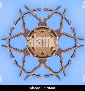 Gothic church architecture made into abstract shape. Geometric kaleidoscope pattern on mirrored axis of symmetry reflection. Colorful shapes as a wall Stock Photo