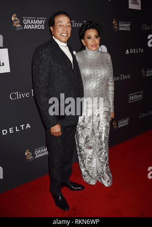 BEVERLY HILLS, CA - FEBRUARY 09: Smokey Robinson (L) and Frances Glandney attend The Recording Academy And Clive Davis' 2019 Pre-GRAMMY Gala at The Be Stock Photo