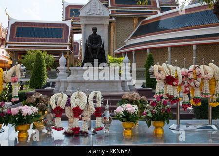 Bangkok Thailand Dec 24  2018, alter with offerings in front of statue of king at Wat Ratchabophit Stock Photo