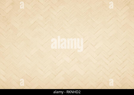 Brown Mat Traditional handicraft bamboo weave texture background. Wicker surface pattern material for wall with antique cracking furniture painted wea Stock Photo