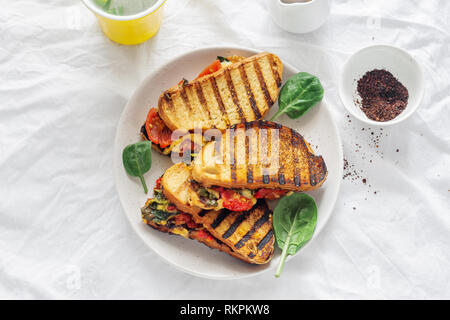 Vegetarian grilled cheese sandwich on white background top view. Tasty breakfast Stock Photo